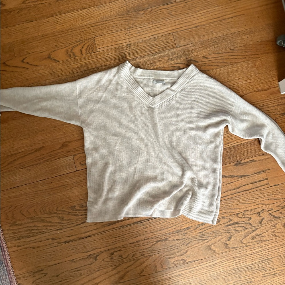 American Eagle cream V-neck sweater